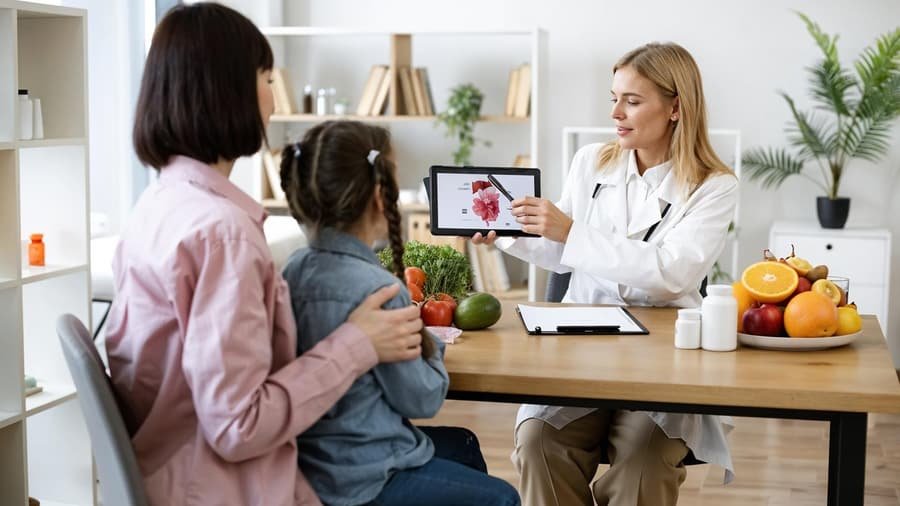 A dietitian talking with a mother and child