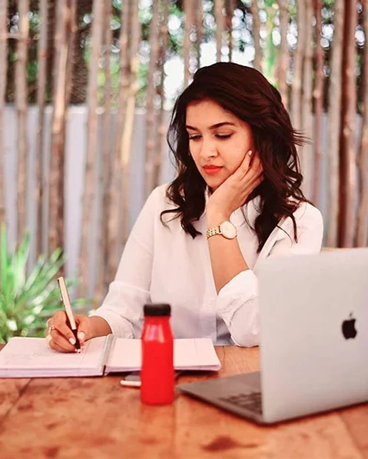 Vineesha working at her desk