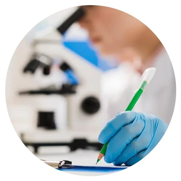 A lab technician analysing samples
